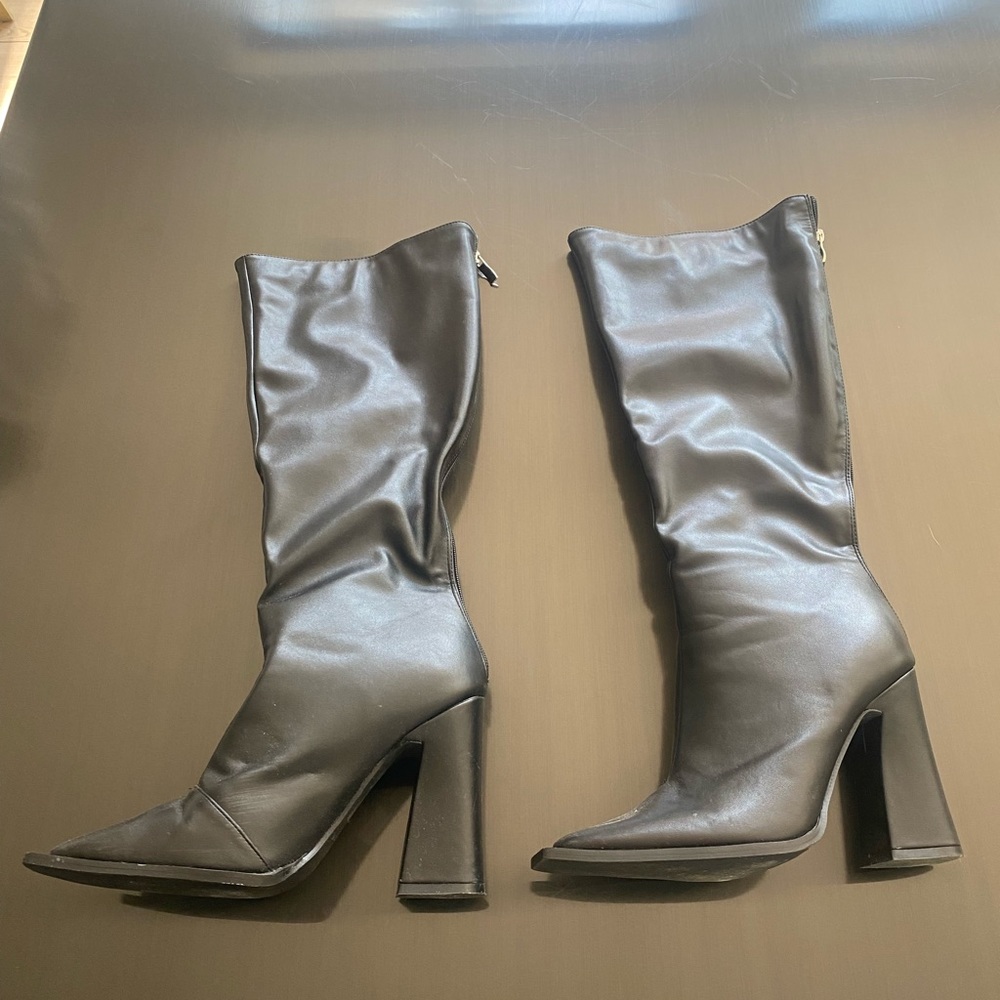 Knee high heeled boots